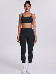 Back view showing fit of criss-cross back cami and leggings active set