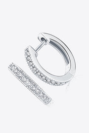 Angled view of slim silver hoops with rows of clear stones along the front edge