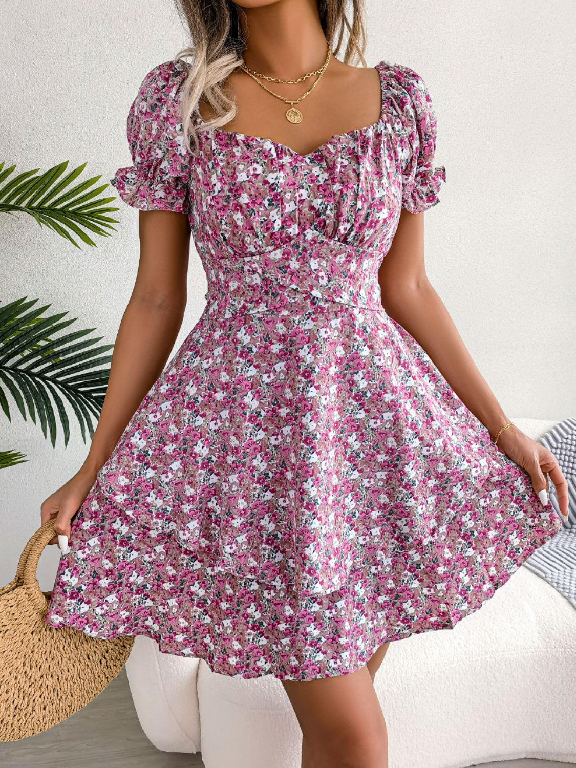 Front view of magenta floral mini dress with sweetheart neckline and flounce sleeves