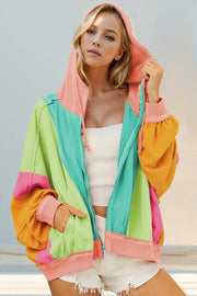 Close view of color-block hoodie's relaxed fit, ribbed cuffs, and contrasting sleeves.
