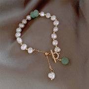 Green stone and pearl bracelet displayed in a product detail view
