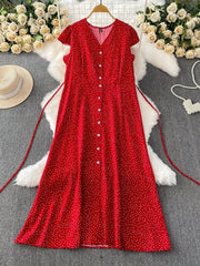 Red polka-dot dress showing button front and tie waist